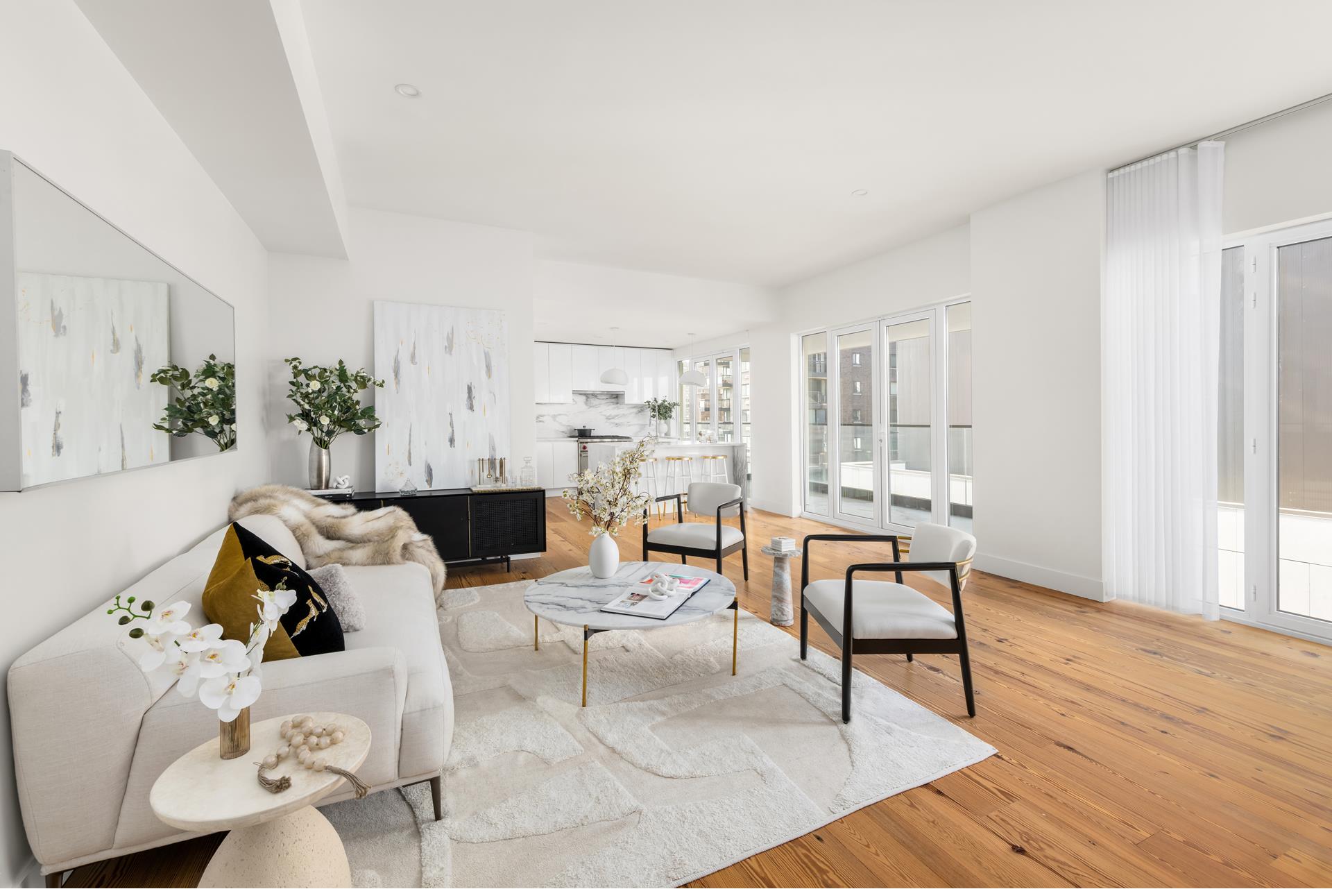 427 East 90th Street, Unit PH10 Manhattan, NY 10128 - Photo 20 of 28 a living room with furniture and a wooden floor