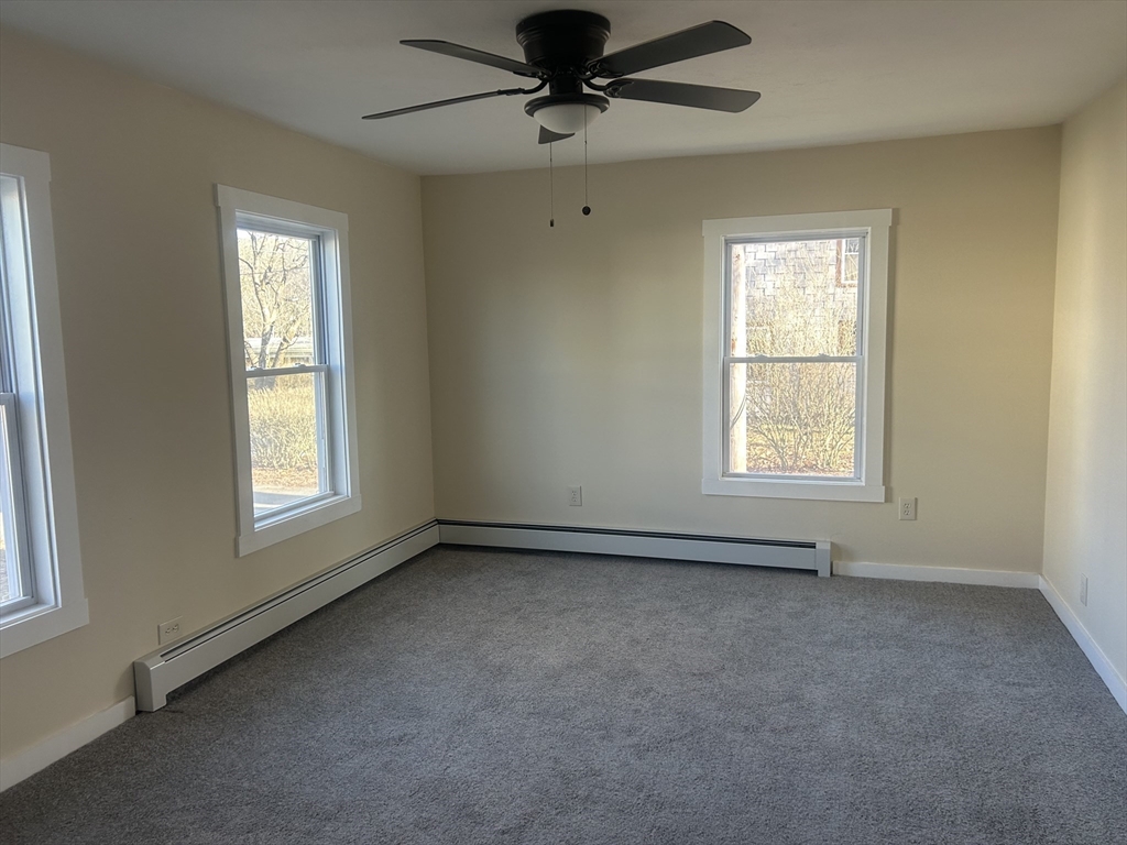 19 Pine Street Athol, MA 01331 - Photo 18 of 25 an empty room with windows and fan