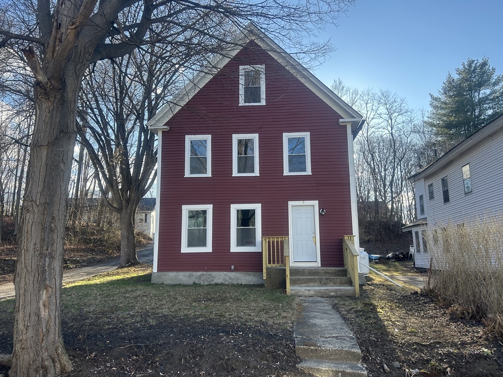 19 Pine Street Athol, MA 01331 - Photo 3 of 25 a view of a brick house with a yard