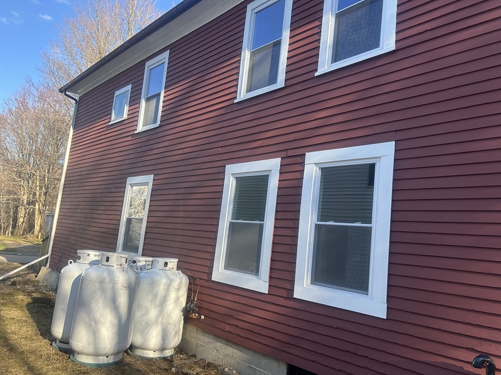 19 Pine Street Athol, MA 01331 - Photo 4 of 25 a view of a brick house with a chairs