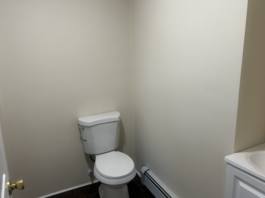 19 Pine Street Athol, MA 01331 - Photo 8 of 25 a white toilet sitting in a bathroom