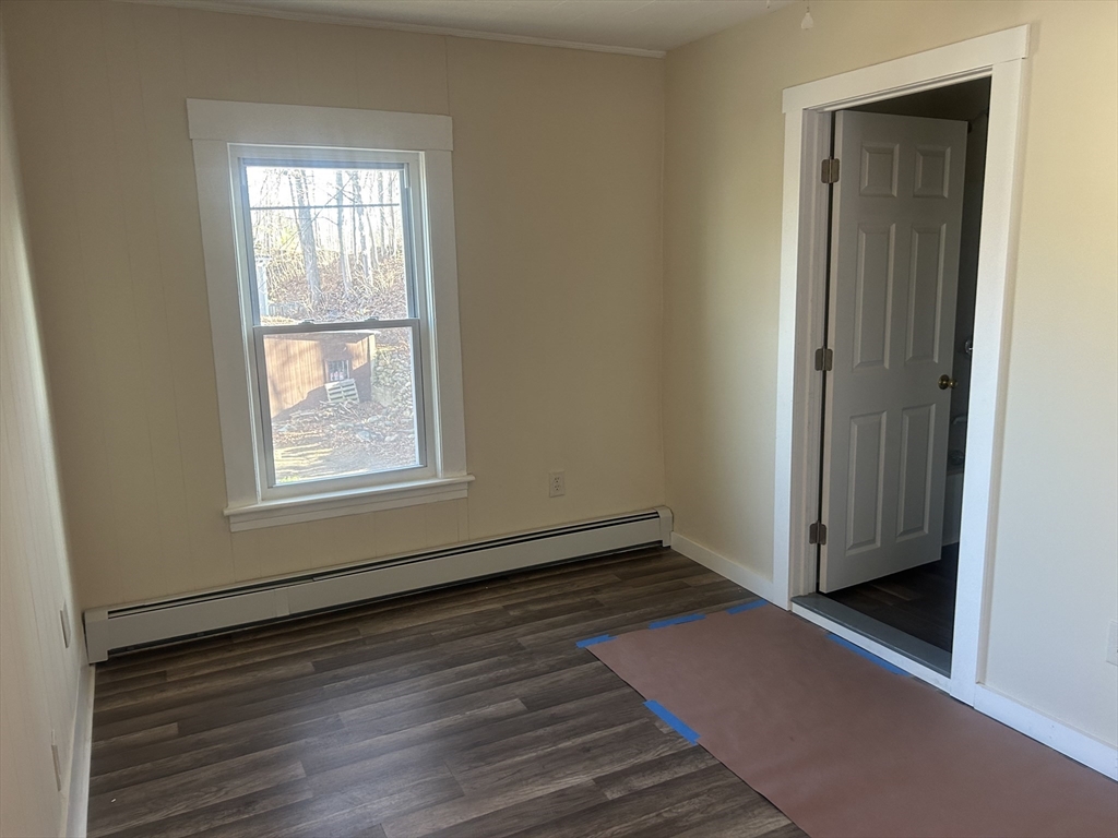 19 Pine Street Athol, MA 01331 - Photo 9 of 25 an empty room with wooden floor and windows