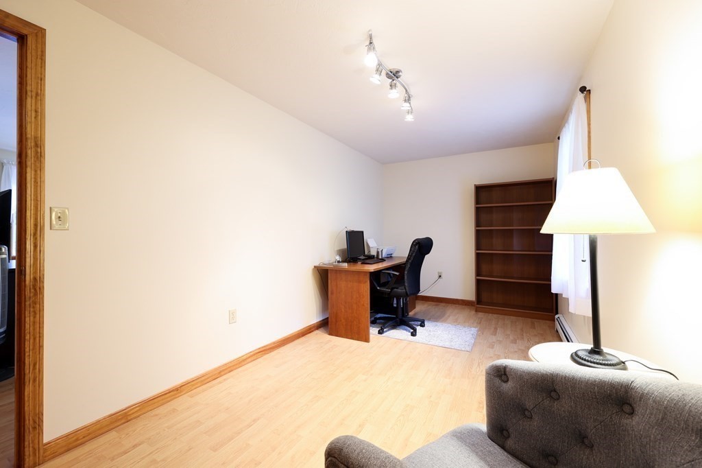 218 Lower Gore Road Webster, MA 01570 - Photo 11 of 40 a living room with furniture and a lamp
