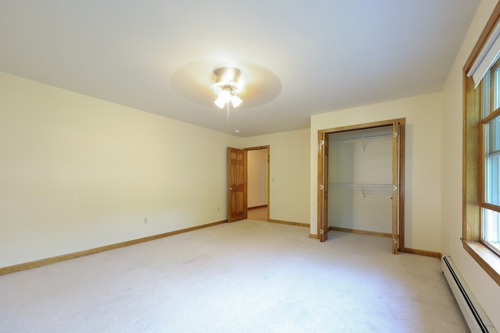 218 Lower Gore Road Webster, MA 01570 - Photo 20 of 40 an empty room with a empty space and a window