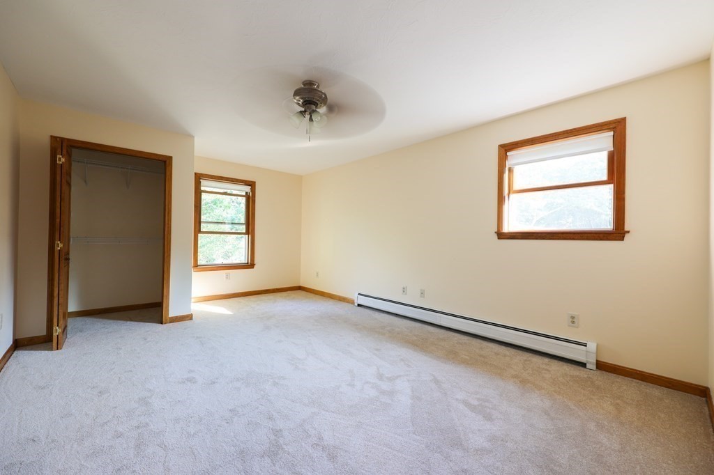 218 Lower Gore Road Webster, MA 01570 - Photo 21 of 40 an empty room with windows and closet