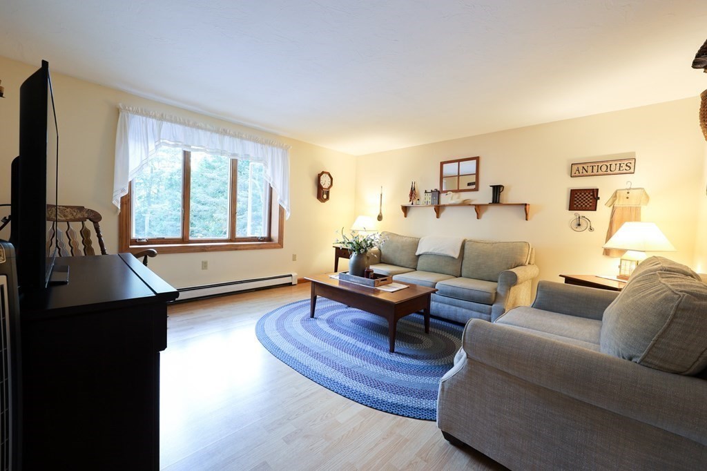 218 Lower Gore Road Webster, MA 01570 - Photo 9 of 40 a living room with furniture and a window