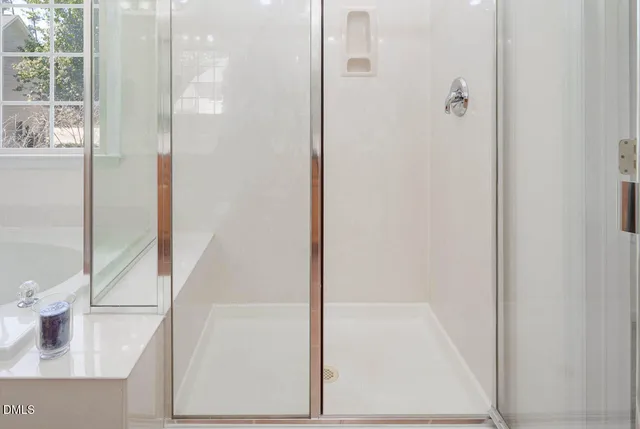 an aerial view of a house with swimming pool and outdoor seating