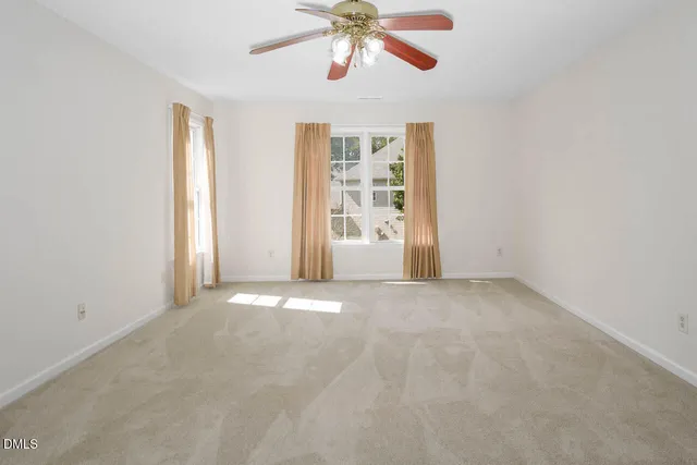 a view of swimming pool with outdoor seating and plants