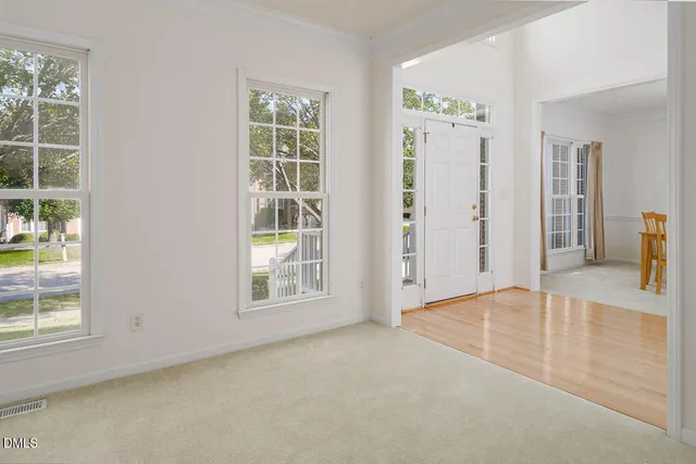 a kitchen with granite countertop stainless steel appliances a sink a window and cabinets