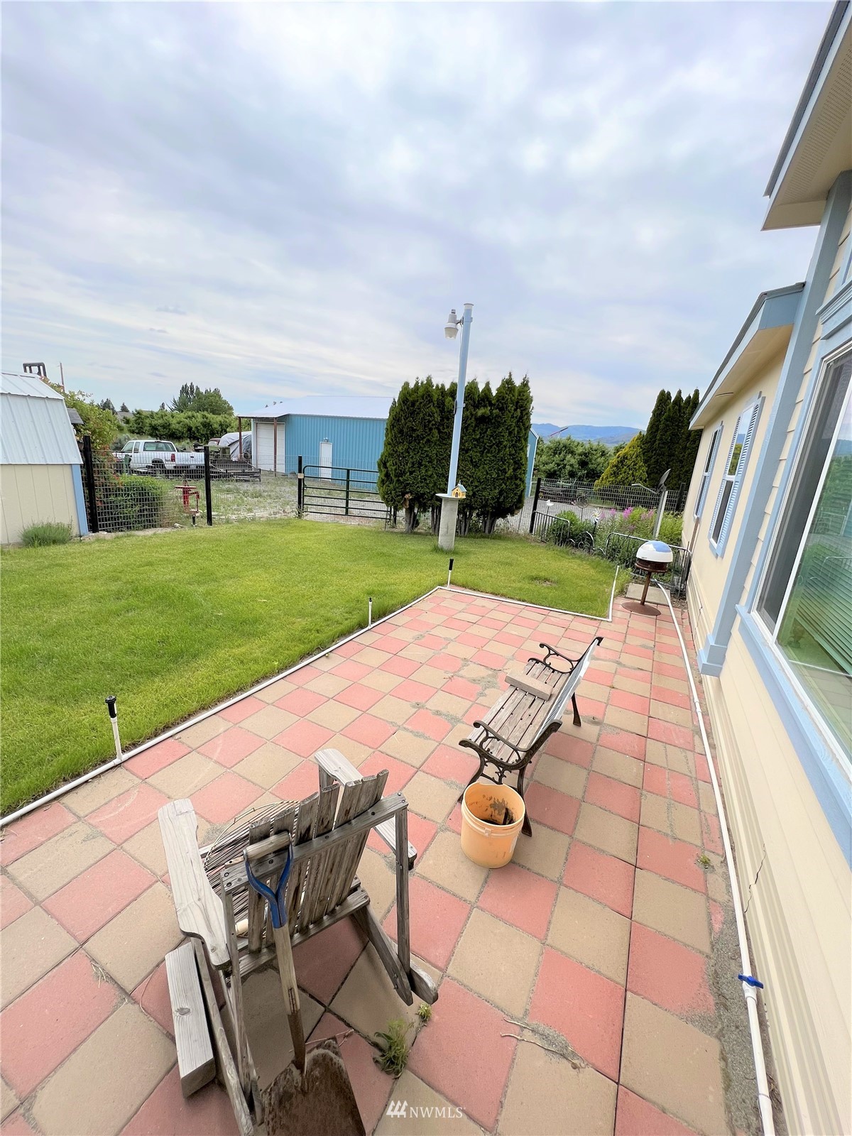 138 Miller Road Omak, WA 98841 - Photo 23 of 39 a view of swimming pool that has lawn chairs with a yard