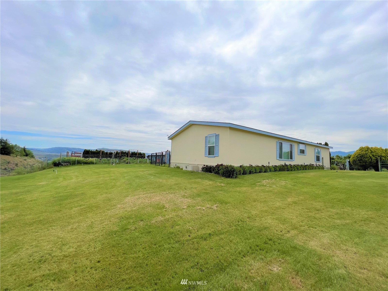 138 Miller Road Omak, WA 98841 - Photo 31 of 39 a house view with swimming pool in front of it