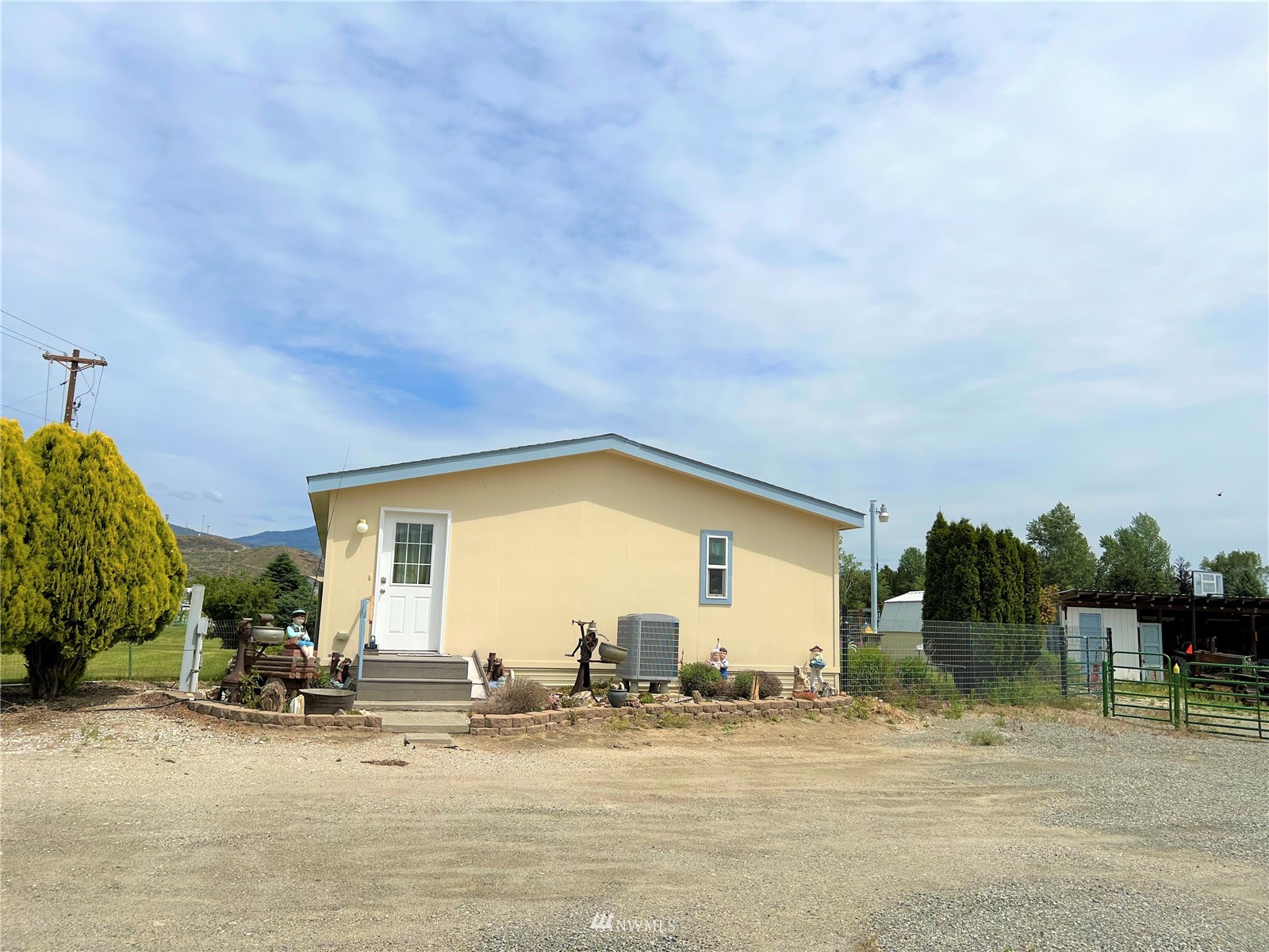 138 Miller Road Omak, WA 98841 - Photo 4 of 39 a view of a house with outdoor space and porch