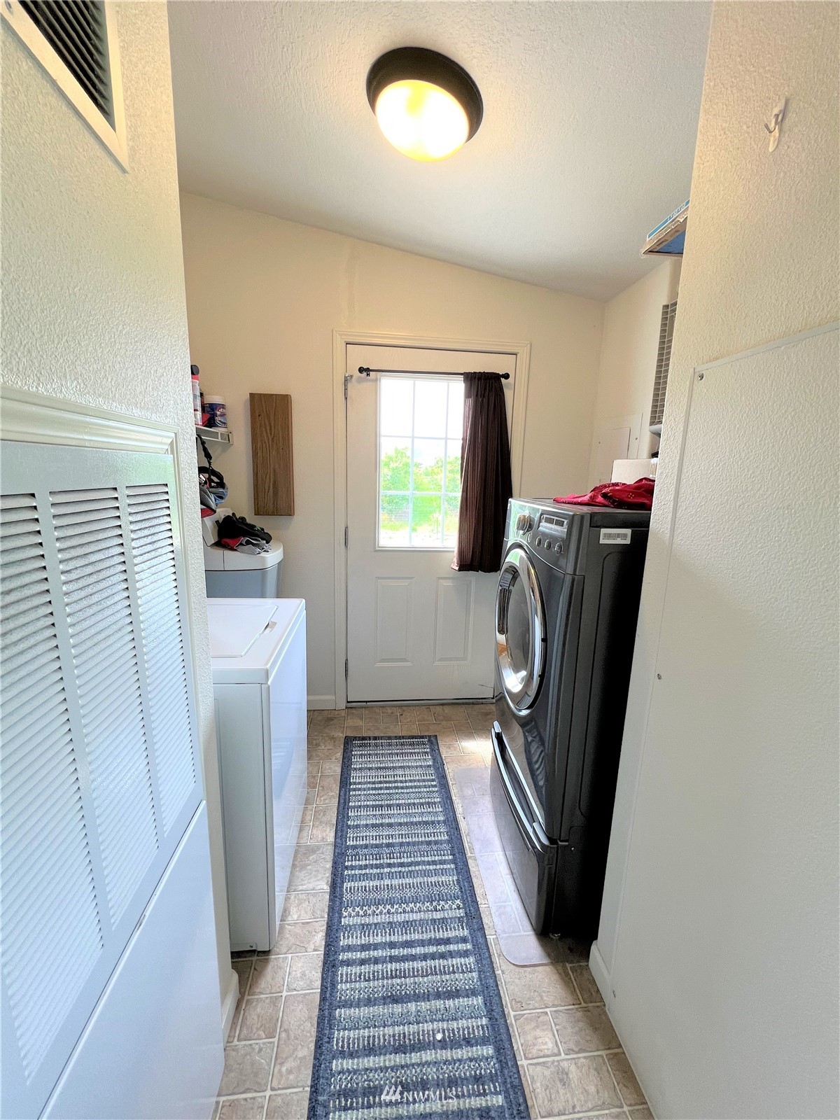 138 Miller Road Omak, WA 98841 - Photo 6 of 39 a view of a storage & utility room with a washer dryer