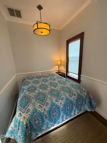 a white toilet sitting next to a bathroom sink and a tub