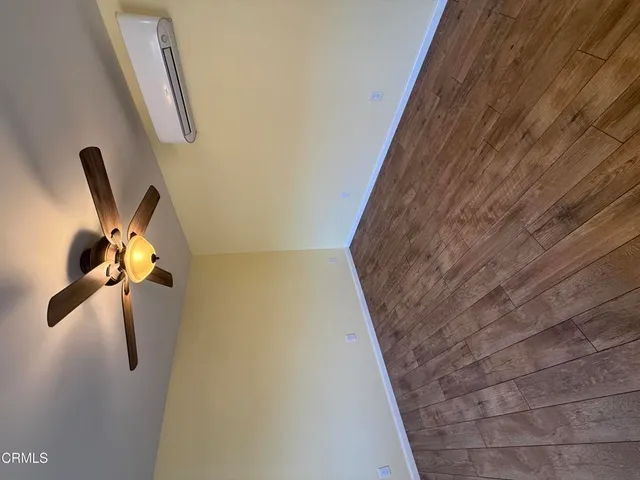 a view of a chairs and table in the backyard