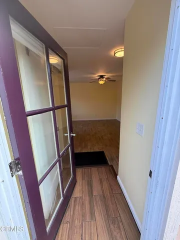 a backyard of a house with barbeque oven table and chairs