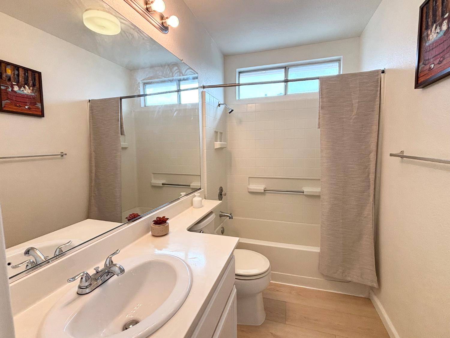 6813 Springridge Way Elk Grove, CA 95758 - Photo 13 of 26 a bathroom with a sink toilet and shower