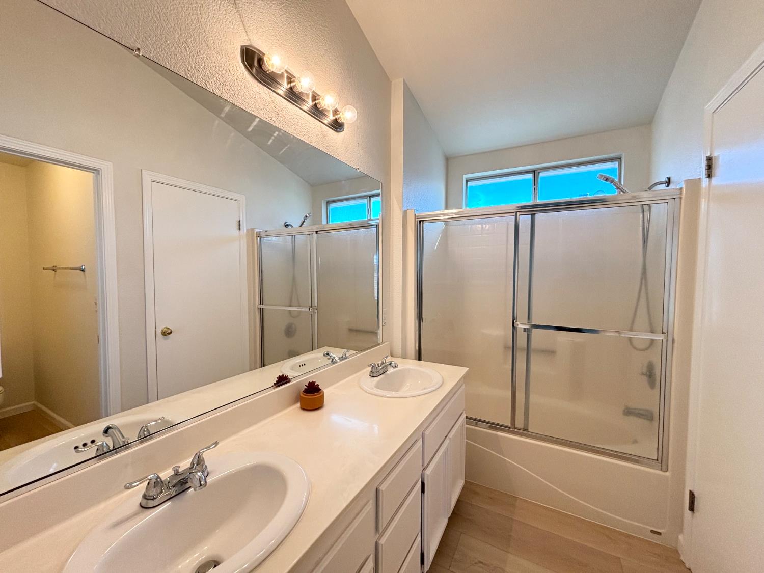 6813 Springridge Way Elk Grove, CA 95758 - Photo 18 of 26 a bathroom with a sink and a mirror