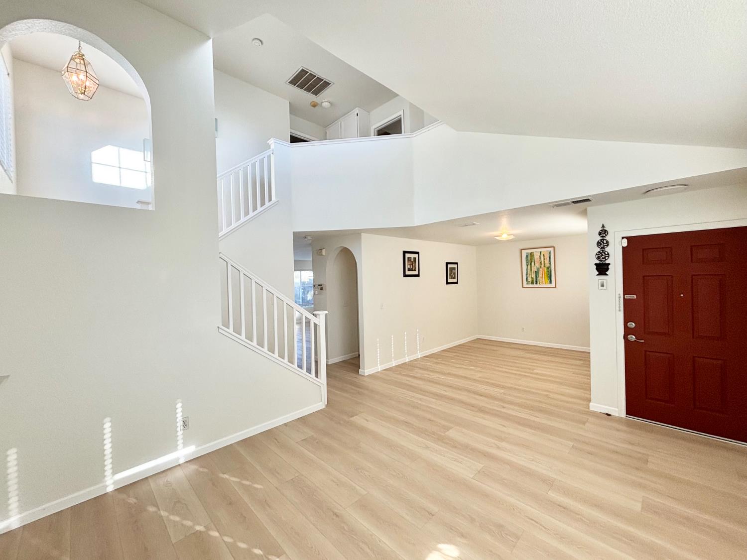 6813 Springridge Way Elk Grove, CA 95758 - Photo 3 of 26 a view of an entryway with wooden floor
