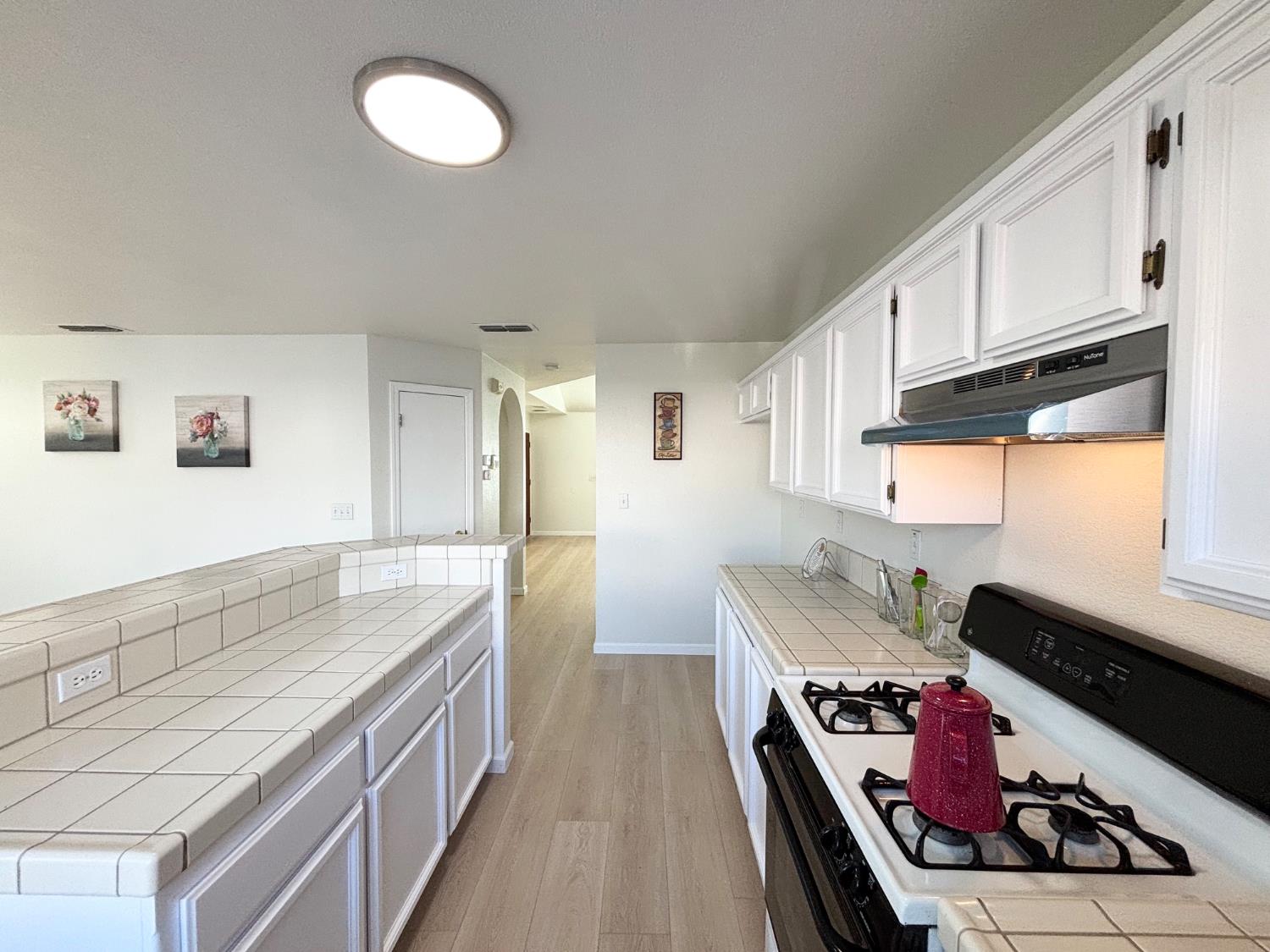 6813 Springridge Way Elk Grove, CA 95758 - Photo 8 of 26 a kitchen with stainless steel appliances granite countertop a stove and a sink