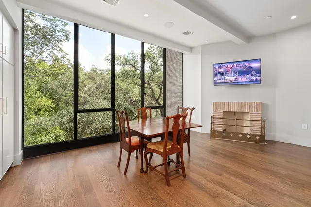 a view of a dining room with furniture and wooden floor