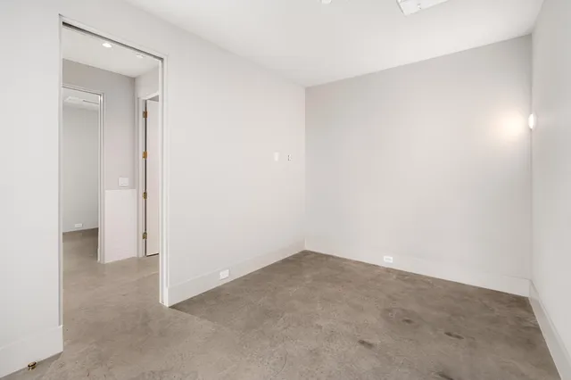 a view of an empty room with a flat screen tv