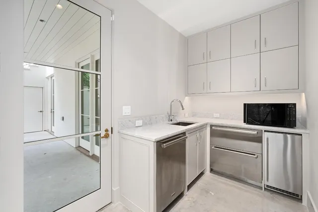 an empty room with wooden floor and window