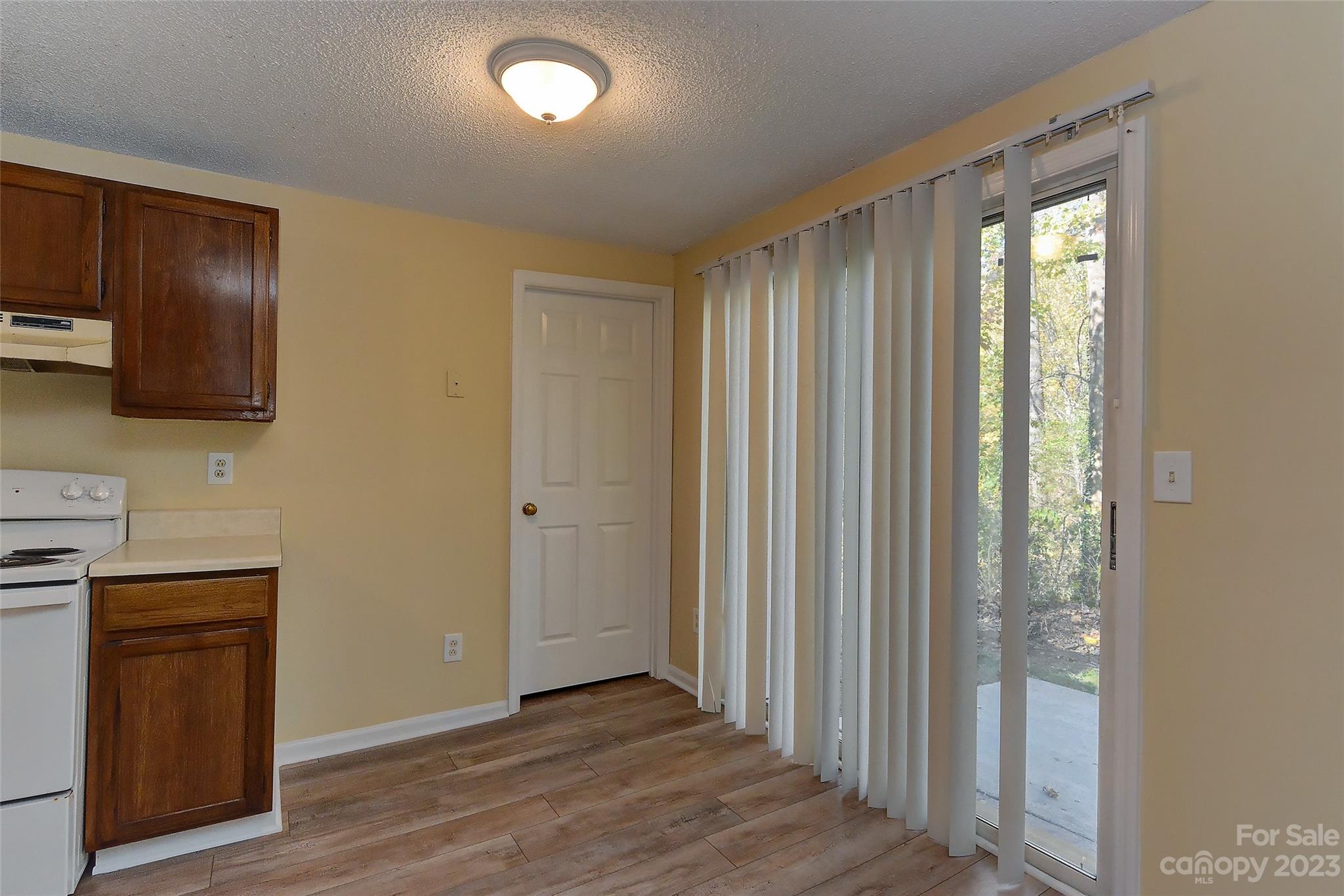6836 Shiloh Ridge Lane Charlotte, NC 28212 - Photo 17 of 30 a view of a livingroom with wooden floor and a window