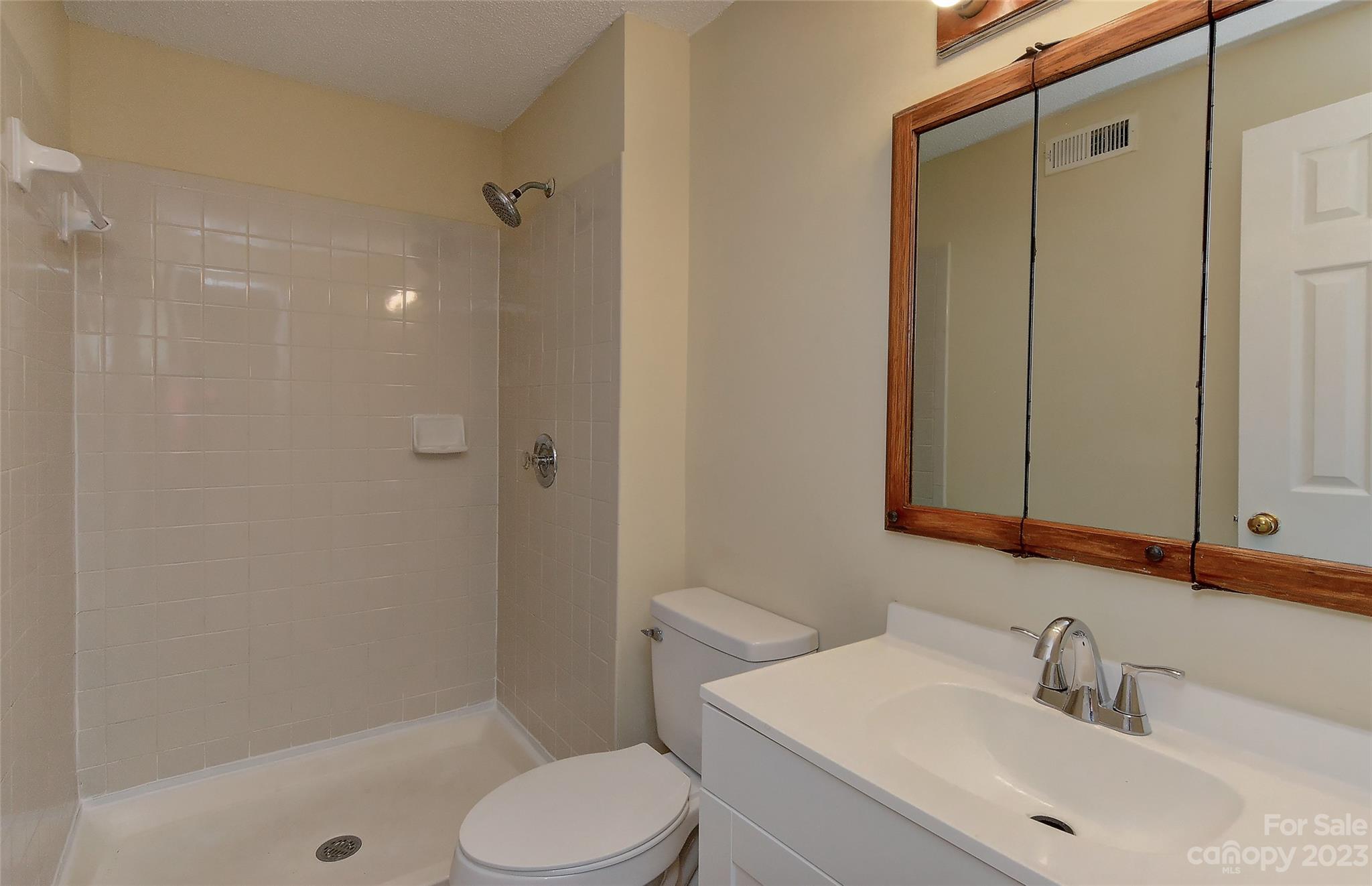 6836 Shiloh Ridge Lane Charlotte, NC 28212 - Photo 21 of 30 a bathroom with a sink toilet and shower