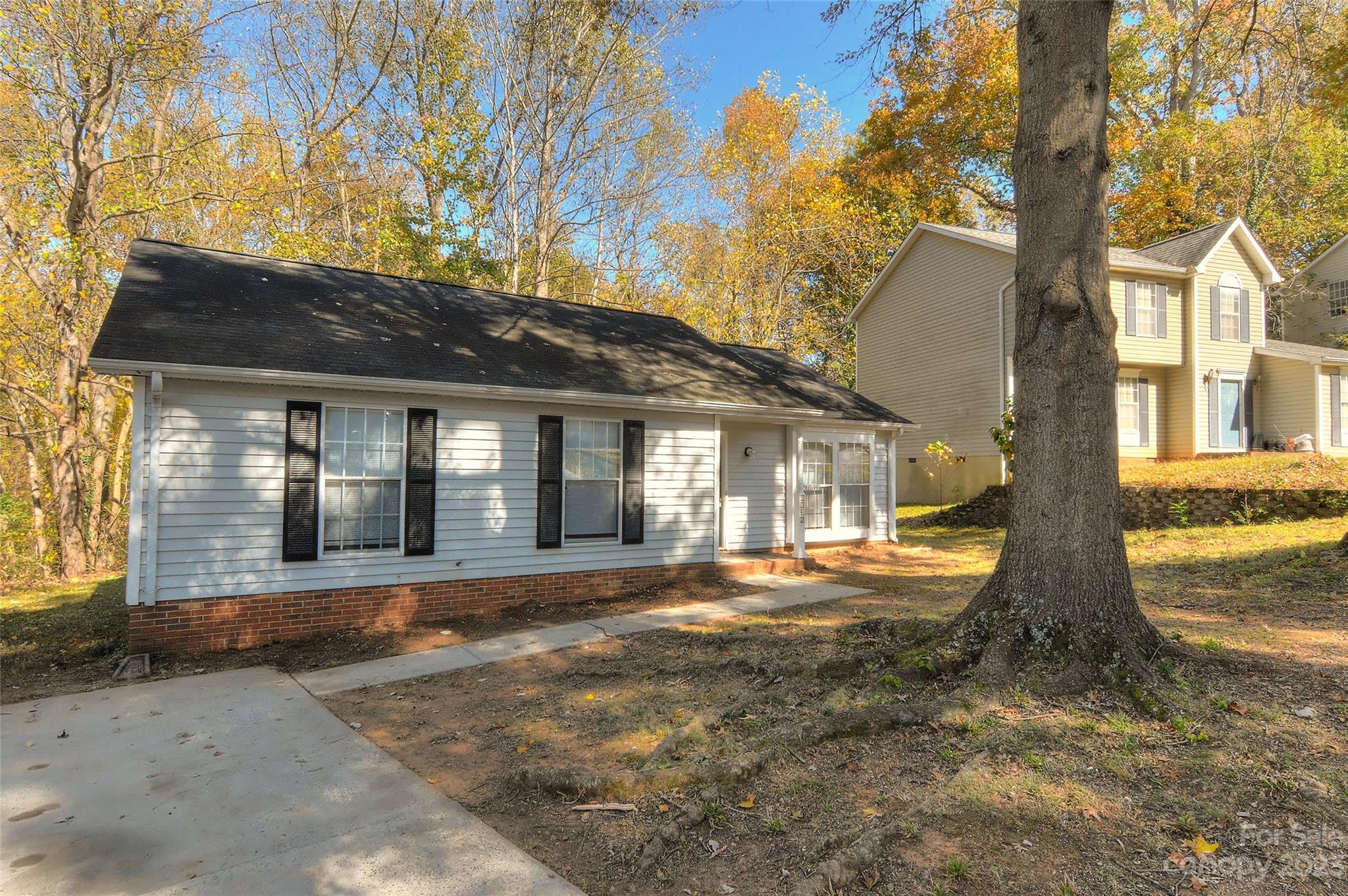 6836 Shiloh Ridge Lane Charlotte, NC 28212 - Photo 3 of 30 a front view of a house with a yard