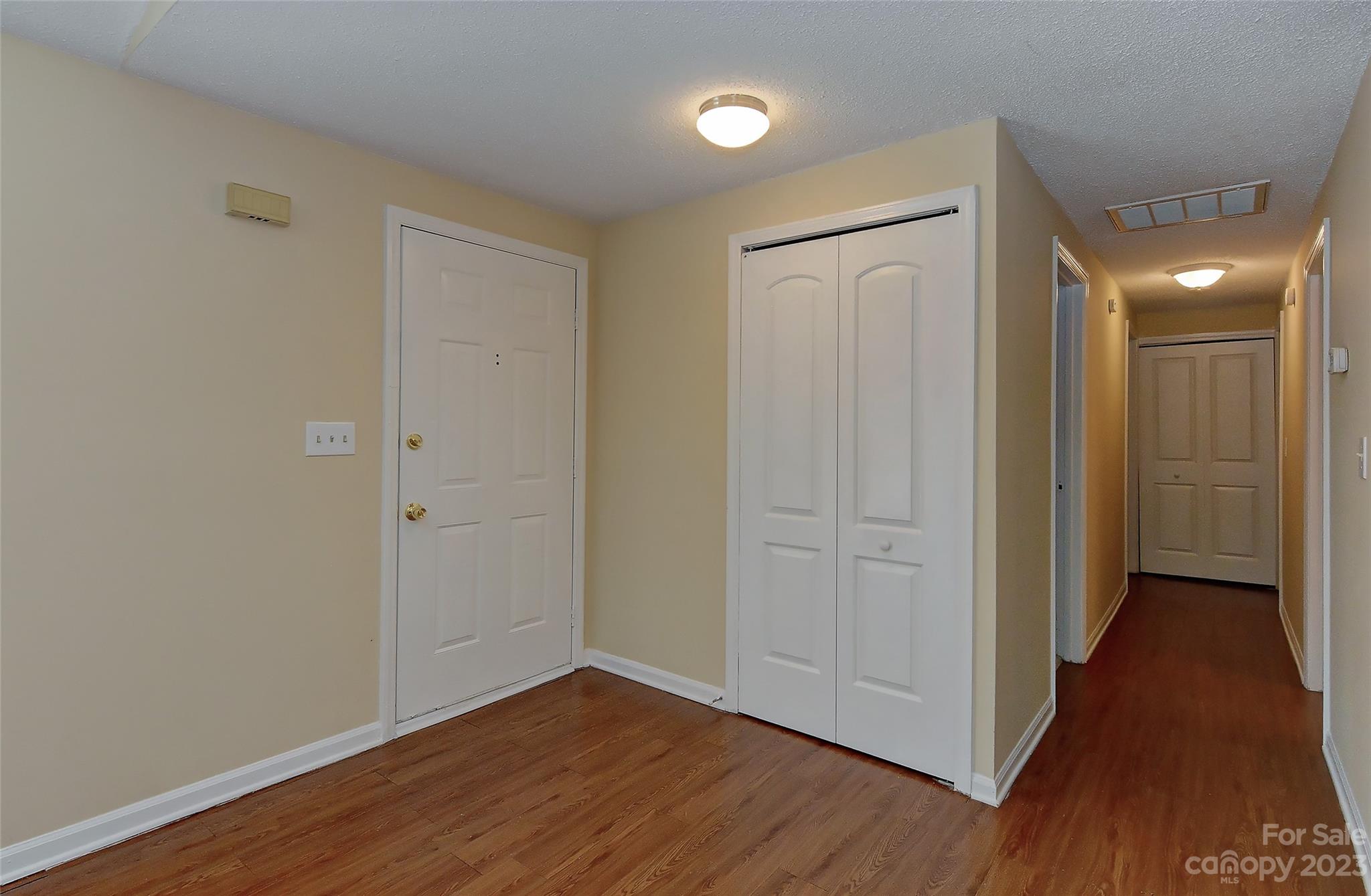 6836 Shiloh Ridge Lane Charlotte, NC 28212 - Photo 5 of 30 a view of a hallway with wooden floor