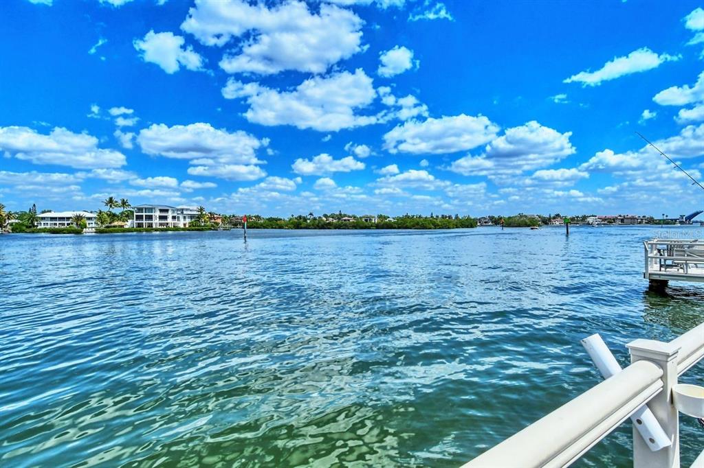 6157 Midnight Pass Road, Unit E63 Sarasota, FL 34242 - Photo 37 of 61 a view of a lake from a yard
