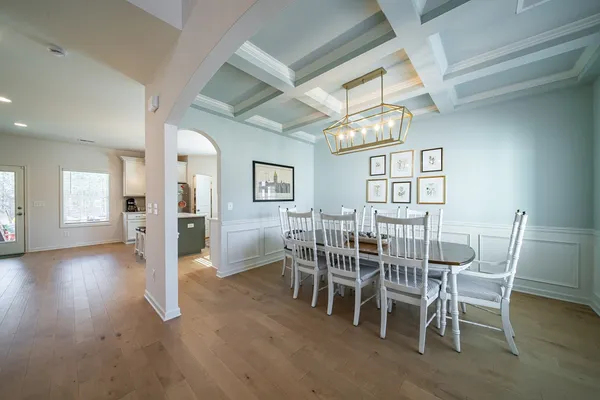 a dining room with furniture and window