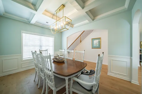 a view of a dining room with furniture and wooden floor