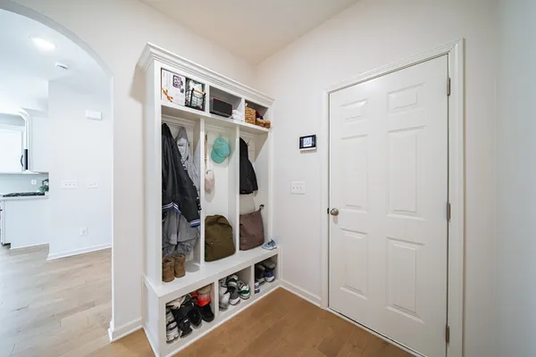 a view of an entryway with wooden floor