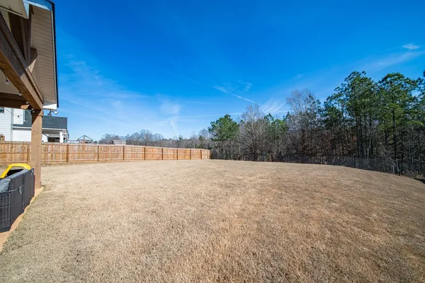 a view of a backyard of the house