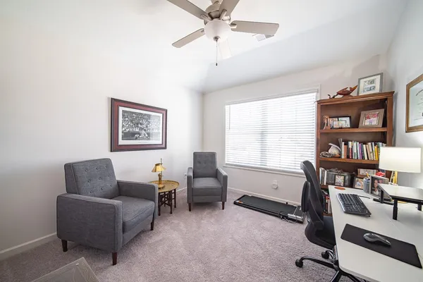 a living room with furniture and a window
