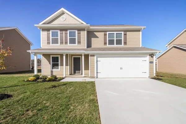 front view of a house with a yard