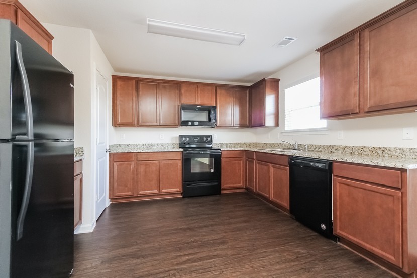 2332 Bee Hive Drive Columbia, TN 38401 - Photo 2 of 18 a kitchen with a refrigerator stove top oven and sink