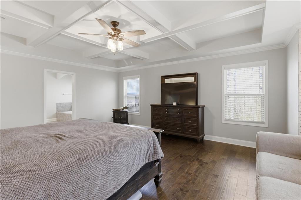 37 Farmstead Way Senoia, GA 30276 - Photo 27 of 121 a spacious bedroom with a bed and a couch