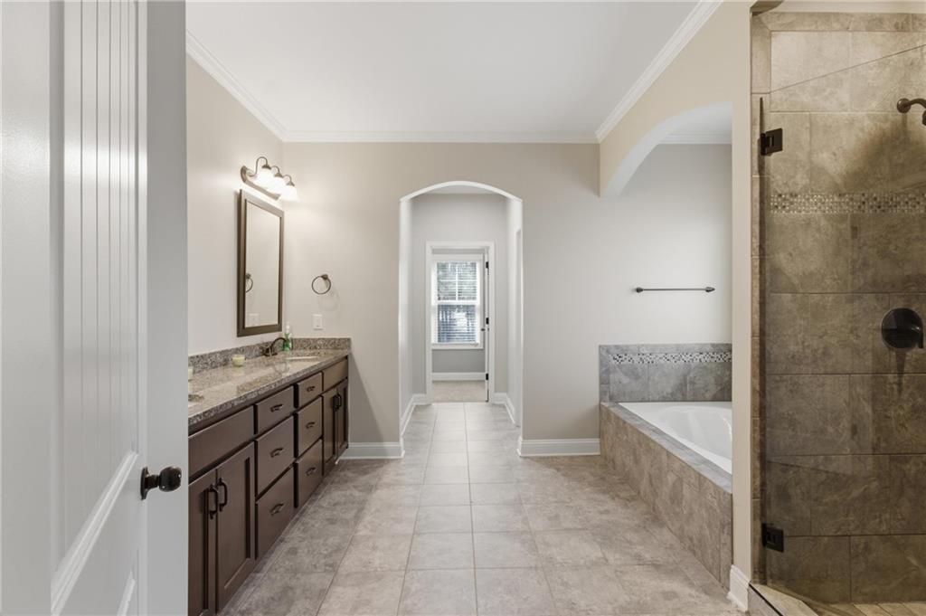 37 Farmstead Way Senoia, GA 30276 - Photo 28 of 121 a bathroom with a double vanity sink and mirror with shower