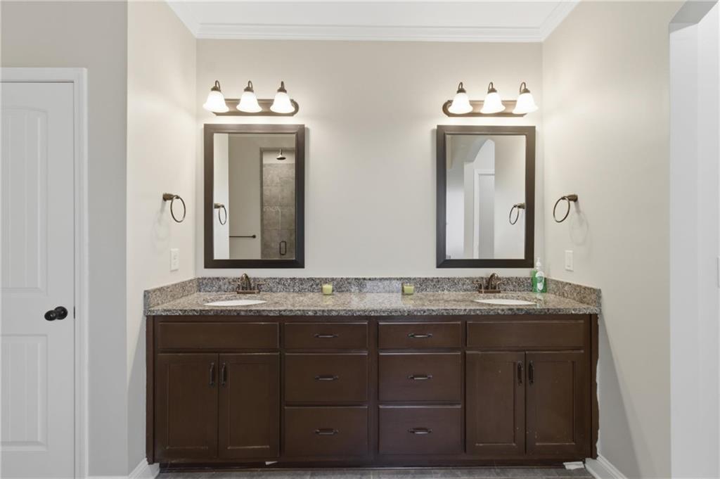 37 Farmstead Way Senoia, GA 30276 - Photo 30 of 121 a bathroom with a granite countertop sink vanity and mirror