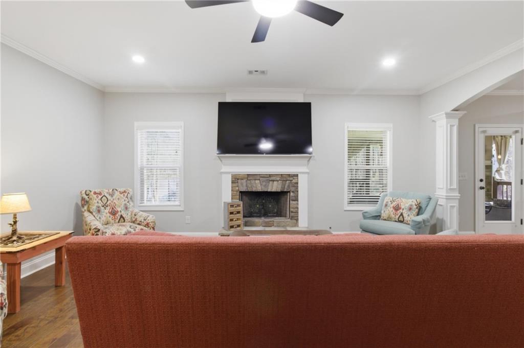 37 Farmstead Way Senoia, GA 30276 - Photo 34 of 121 a living room with furniture a flat screen tv and a fireplace