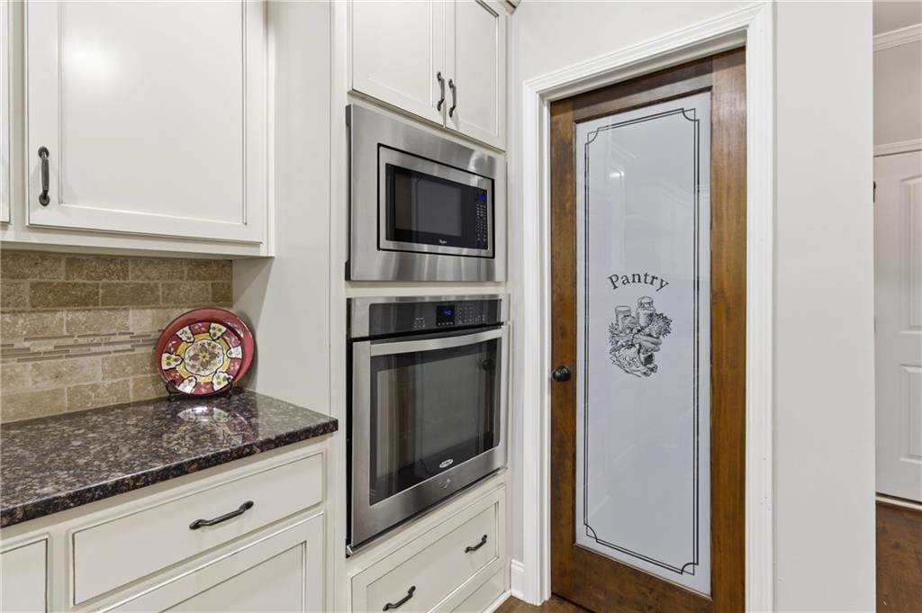 37 Farmstead Way Senoia, GA 30276 - Photo 41 of 121 a kitchen with granite countertop stainless steel appliances and a counter top space