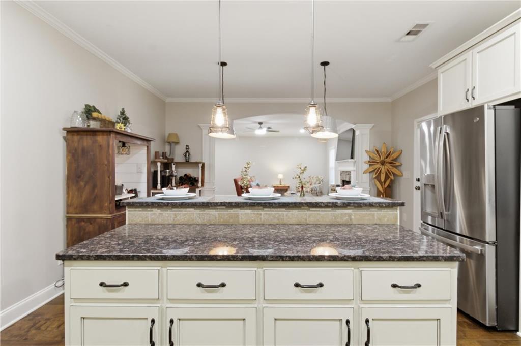 37 Farmstead Way Senoia, GA 30276 - Photo 42 of 121 a kitchen with kitchen island a counter top space appliances and cabinets