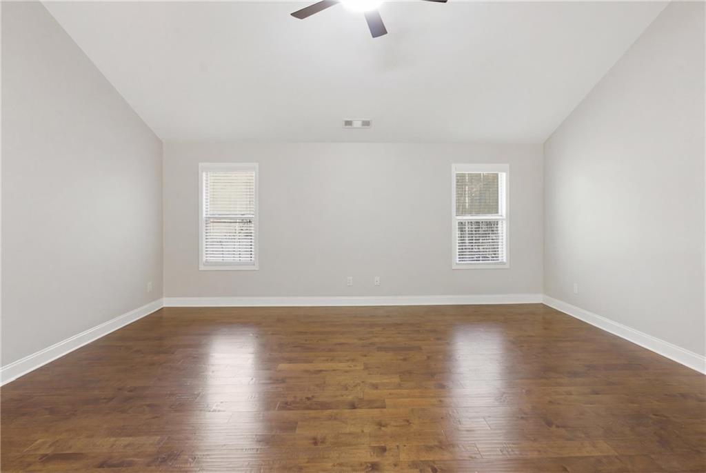 37 Farmstead Way Senoia, GA 30276 - Photo 56 of 121 an empty room with wooden floor and windows