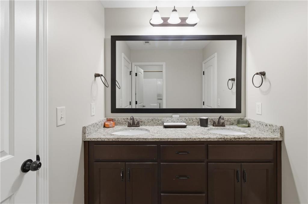 37 Farmstead Way Senoia, GA 30276 - Photo 63 of 121 a bathroom with a double vanity sink and mirror
