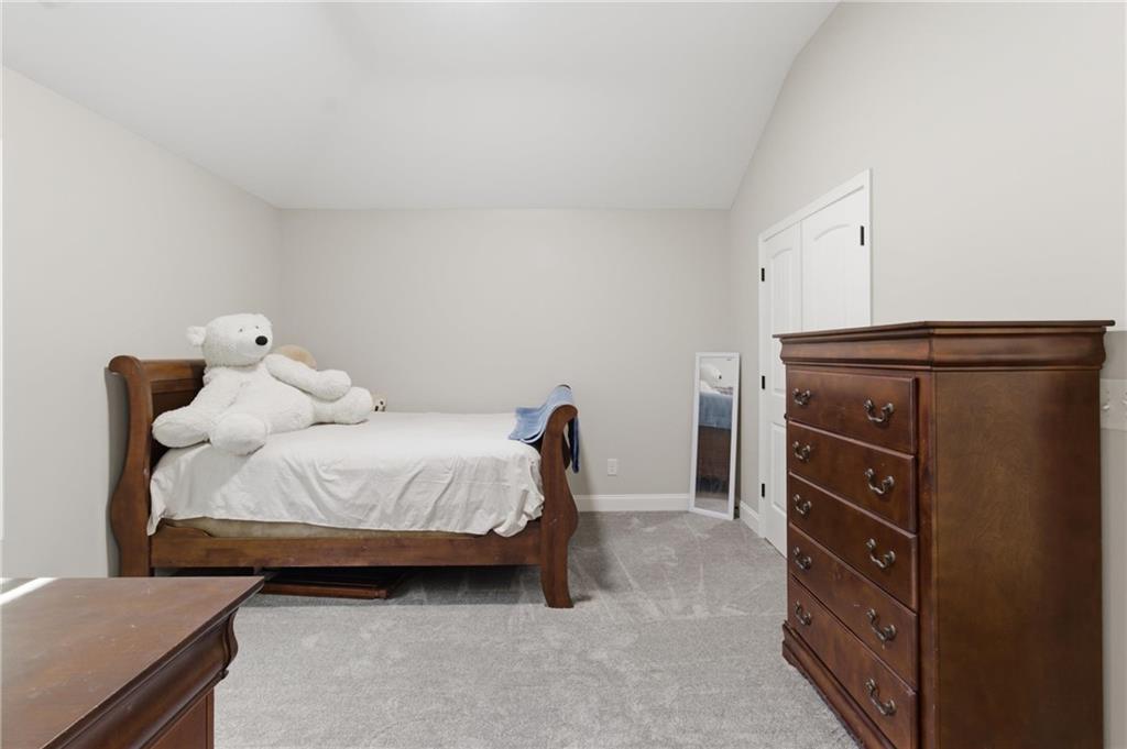 37 Farmstead Way Senoia, GA 30276 - Photo 65 of 121 a bedroom with a bed and a dresser