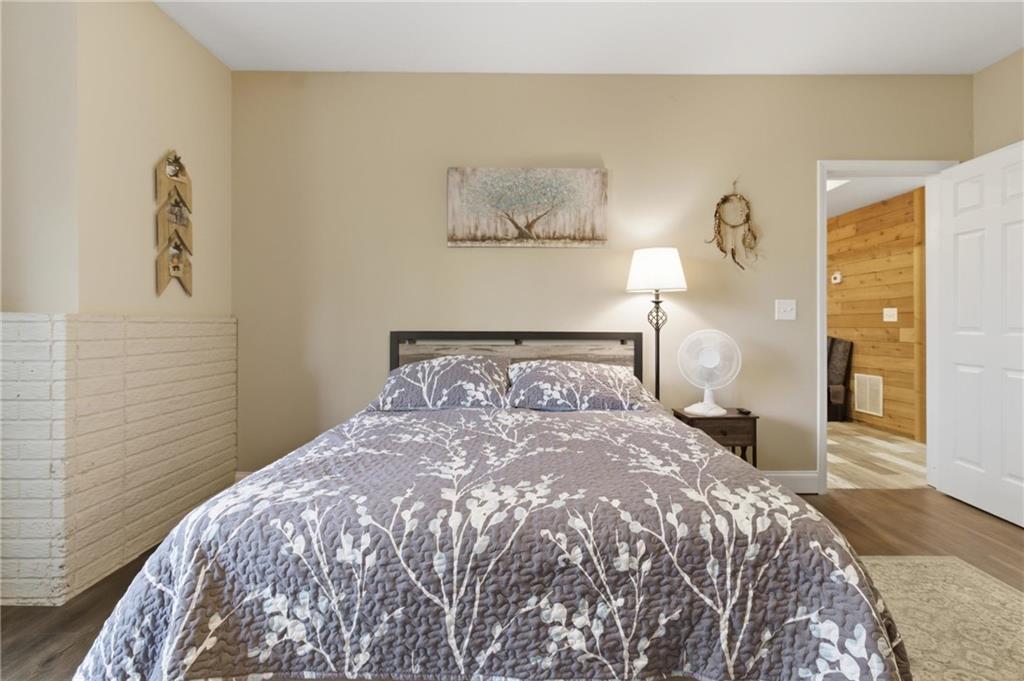 37 Farmstead Way Senoia, GA 30276 - Photo 81 of 121 a bedroom with a bed and painting on the wall