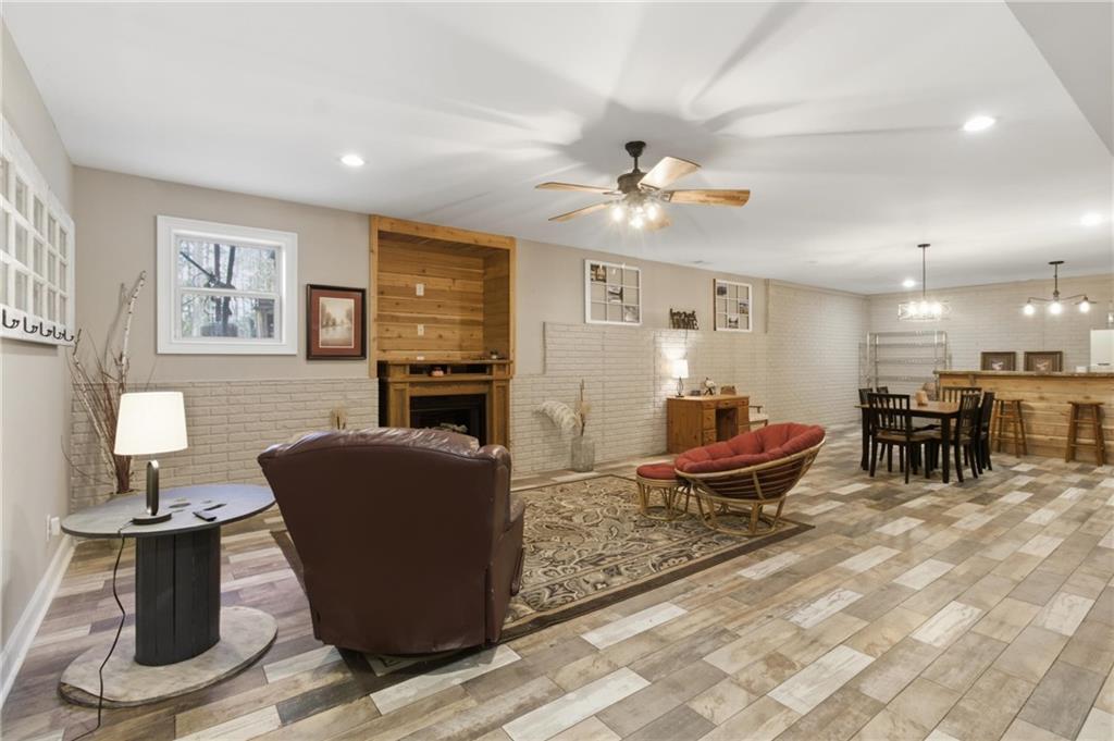37 Farmstead Way Senoia, GA 30276 - Photo 83 of 121 a living room with furniture a dining table and kitchen view